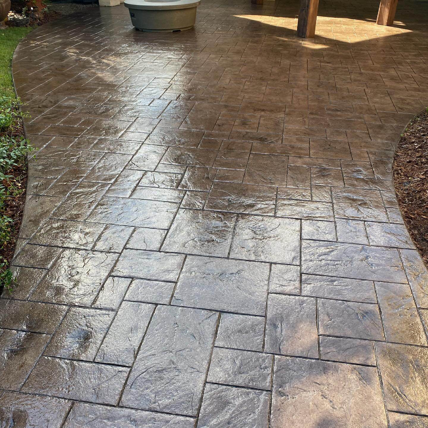 Stamped concrete patio looking new again after being repaired